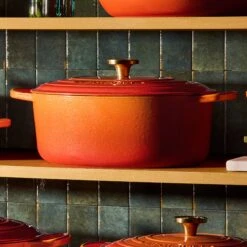 Le Creuset Signature Cast Iron 6.75-quart Flamme Doree Oval Dutch Oven 8 Le Creuset Signature Cast Iron 6.75-quart Flamme Doree Oval Dutch Oven -Zwilling Shop 20241011 Q125FLAMMEDOREESHELF 011